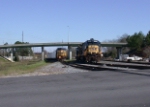 CSX 7693 with brand new hoppers from HOG yard passing local power